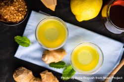 Top view of detox shots on napkin with lemon, ginger and mint on napkin 5aYjv5