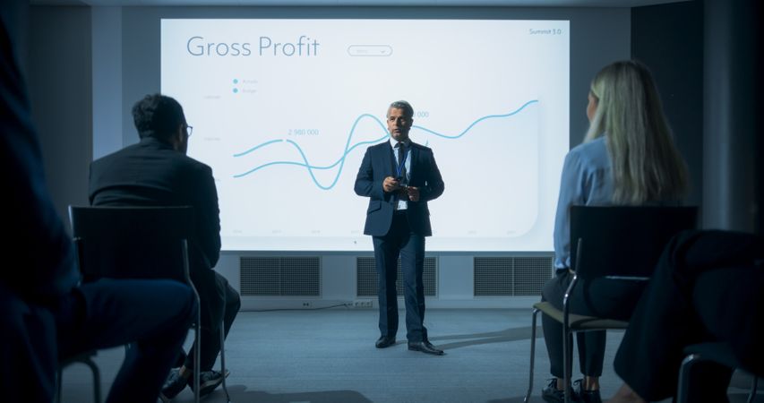 Corporate Event: Male Tech CEO Giving Presentation To Colleagues or Investors In Conference Room Of Innovative Startup Office.