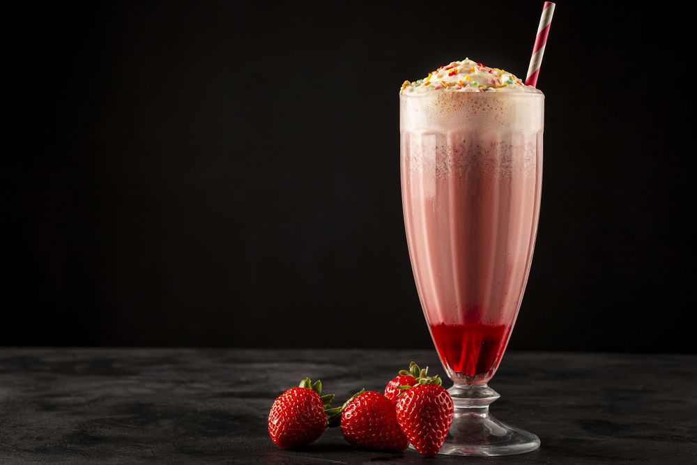 Strawberry milkshake with whipped cream.