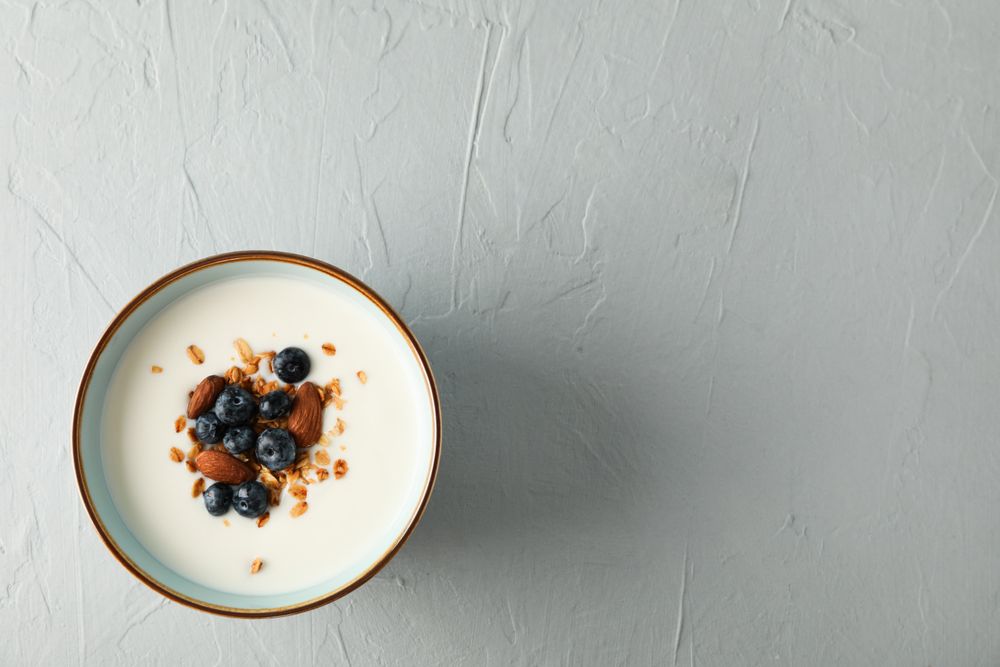 Bowl with parfaits dessert on cement background