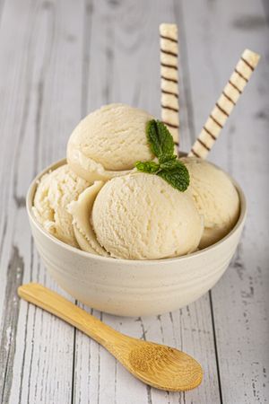 Bowl with vanilla ice cream balls.