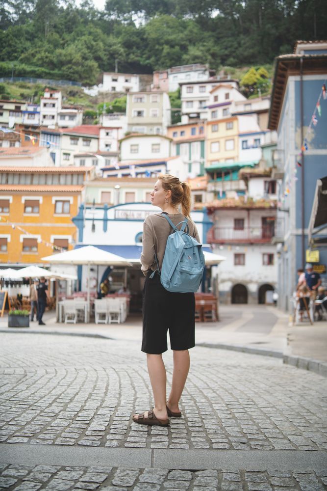 Traveler walking on street with colorful buildings