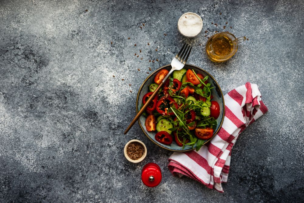 Top view of healthy fresh salad with flax seeds