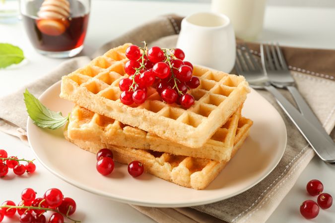 Beautiful composition with sweet belgian waffles, space for text