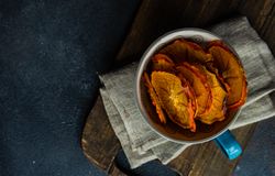 Top view of dried persimmon fruit slices in tea cup