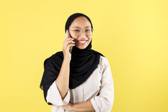 Hijab Woman Smiling Facing Camera Holding Smartphone Doing Phone Call