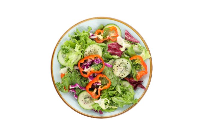 Plate with fresh salad isolated on blank background