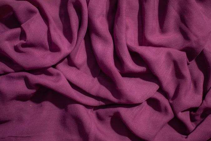 Soft purple fabric wavy crumpled background abstract.