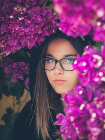 Woman on background of stunning violet flowers