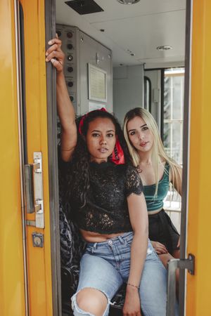 Friends sitting on train in drivers cabin