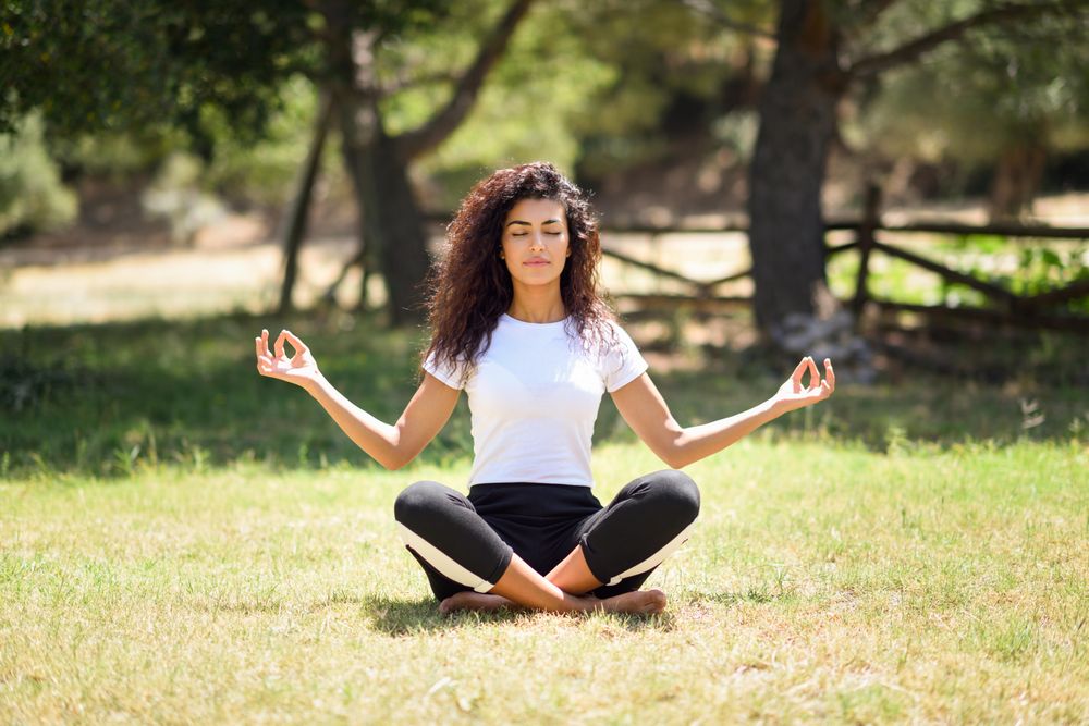 Arab woman doing meditation in nature