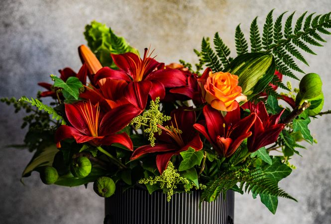 Red and orange flower composition with lilies