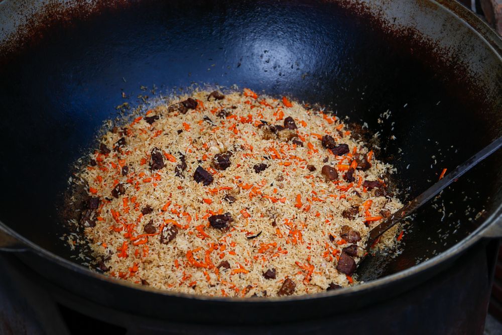 Pilaf cooking on a fire.