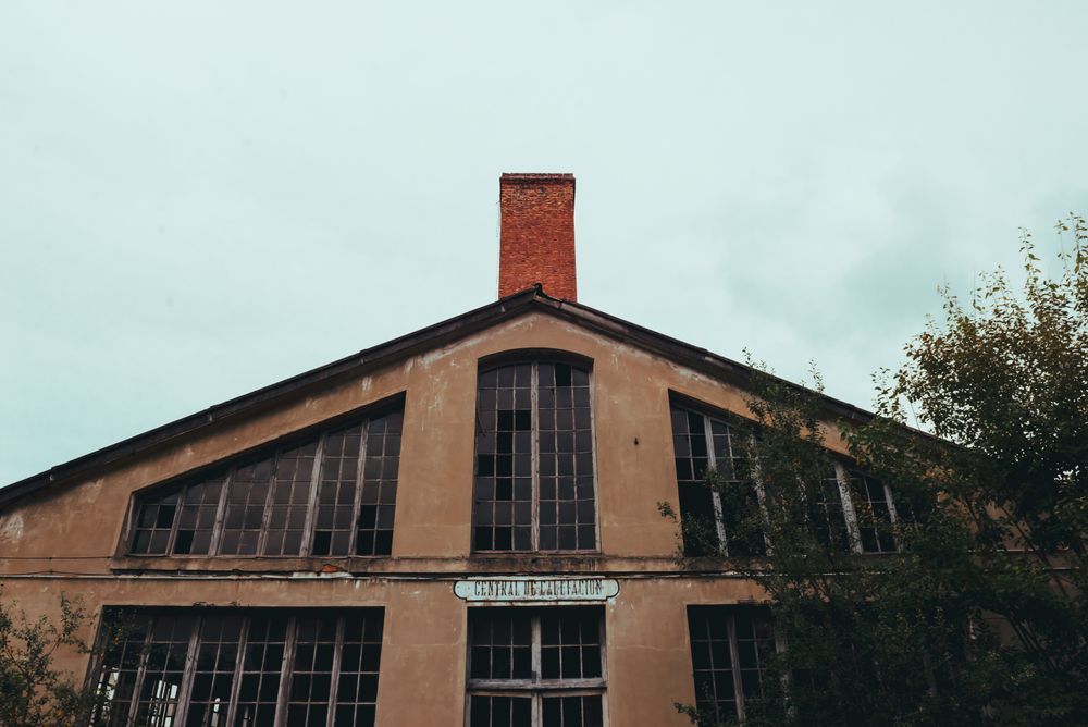 Facade of old building and cloudy sky