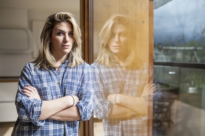 Woman at home looking at camera