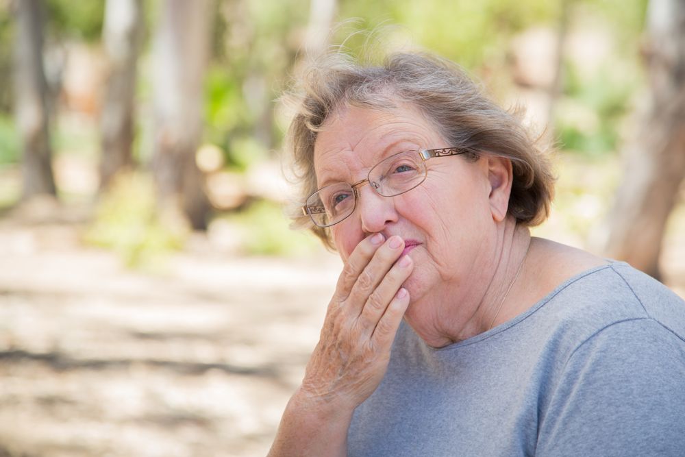 Upset Older Woman Sitting Alone