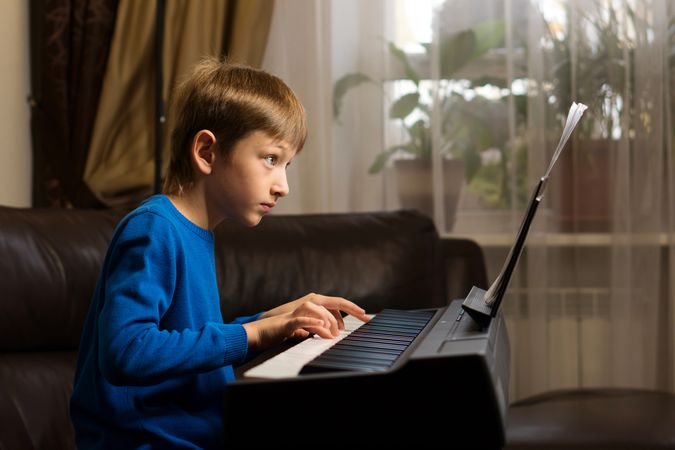 Boy's Piano Practice Session