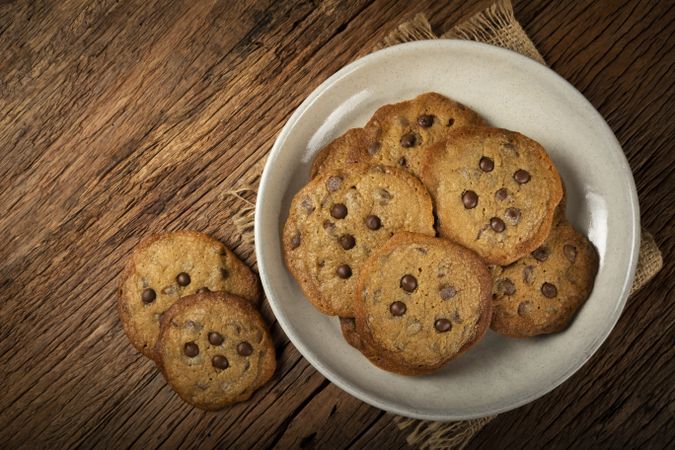 Delicious chocolate cookies on wooden table.