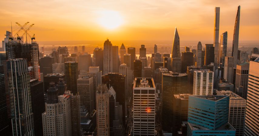 Urban Sunset Scenery with Midtown Manhattan. Historic and Modern New York City Skyscrapers, New Building Under Construction. Aerial View of a Popular American Travel and Business Destination