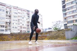 Young Black Man Playing Basketball.