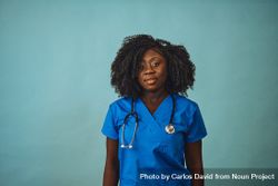 Portrait of Black medical professional dressed in scrubs bxaRM0