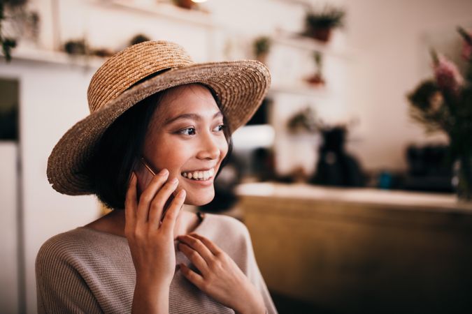 Young woman in a good mood talking on a mobile phone