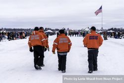 Nisswa, MN, USA - January 25th, 2020: Men in dive rescue gear patrolling an ice fishing competition 0vMYgb