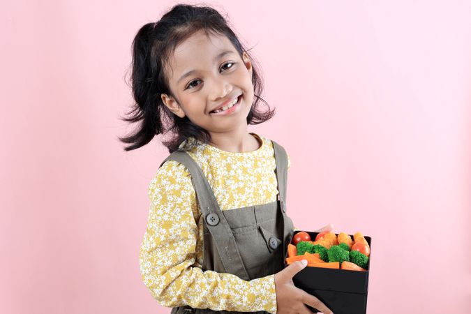 Smiling Asian Girl with Her Healthy School Lunchbox