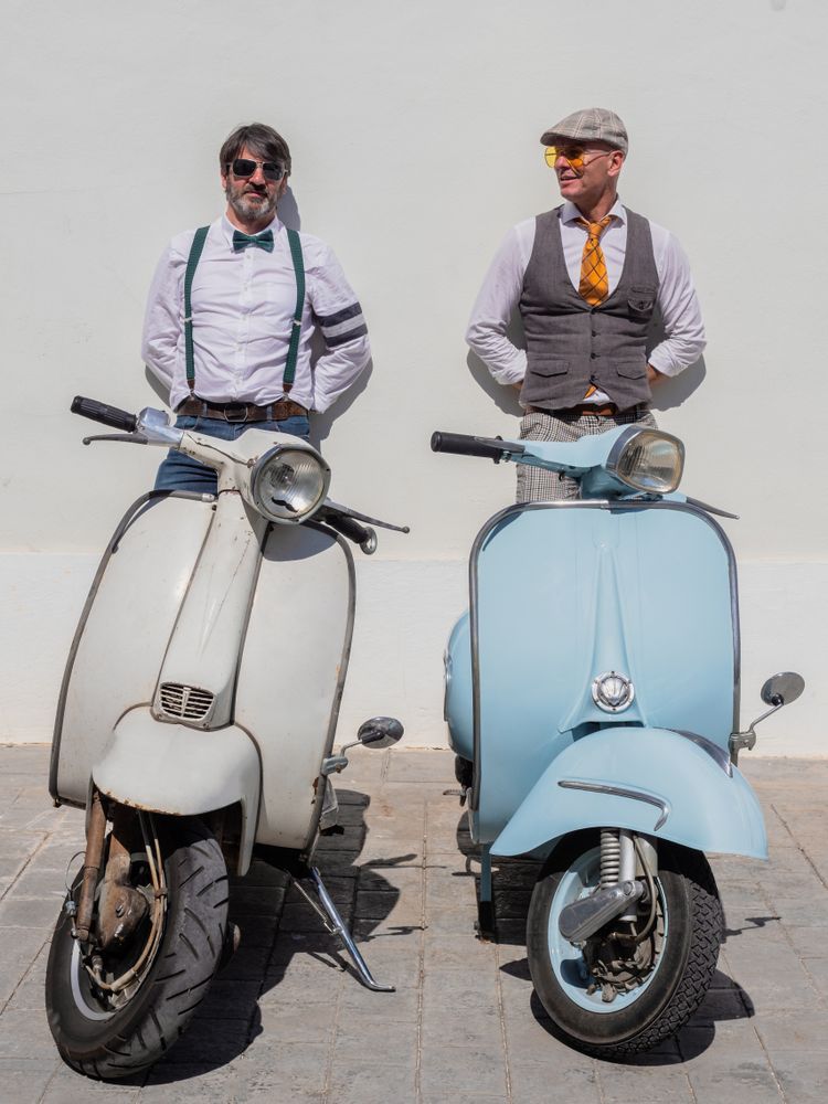 Trendy  friends with vintage scooters