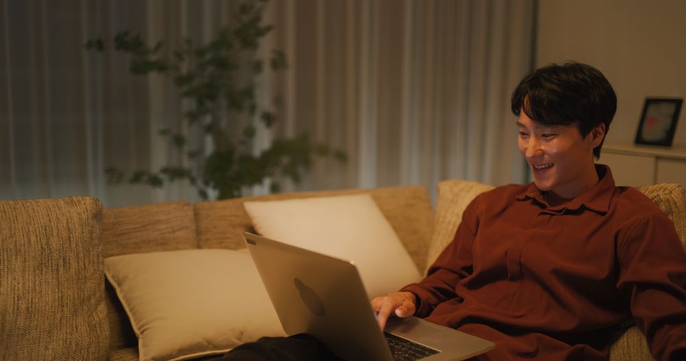 Young Man Connecting with Creators, Leaving Encouraging Feedback Comments