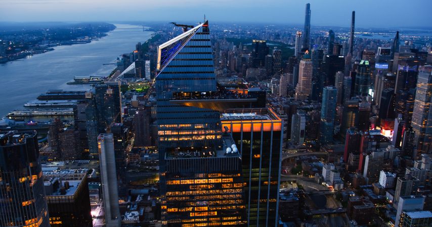Helicopter Night Photo of the Manhattan Skyline, Locked on 30 Hudson Yards Skyscraper with an Outside Observation Deck. Crowd of People Enjoying Evening View From a Viewing Platform