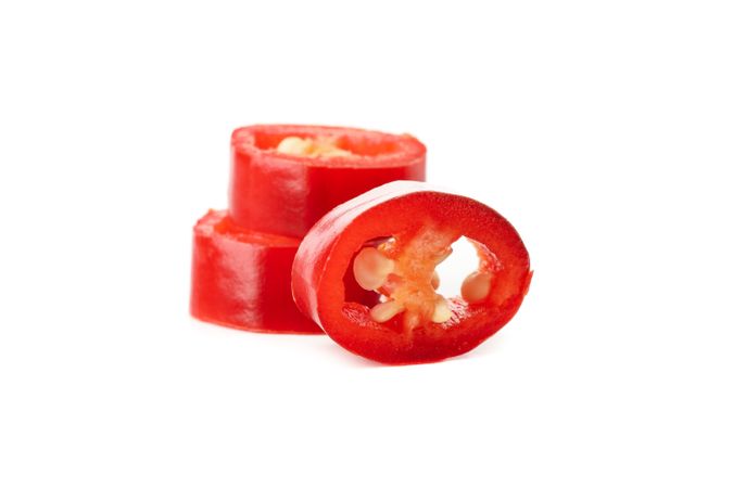Chilli pepper slices isolated on blank background