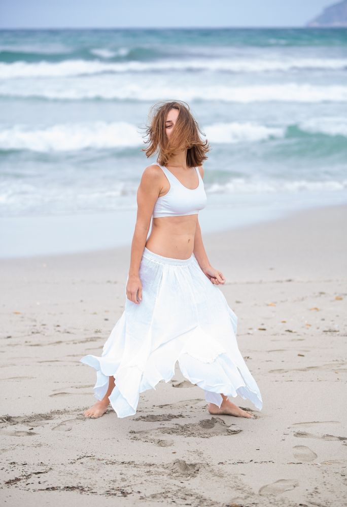 woman dancing near sea