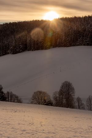Winter sunrise in mountains with deep snow