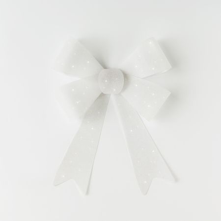 Single gift bow on light background