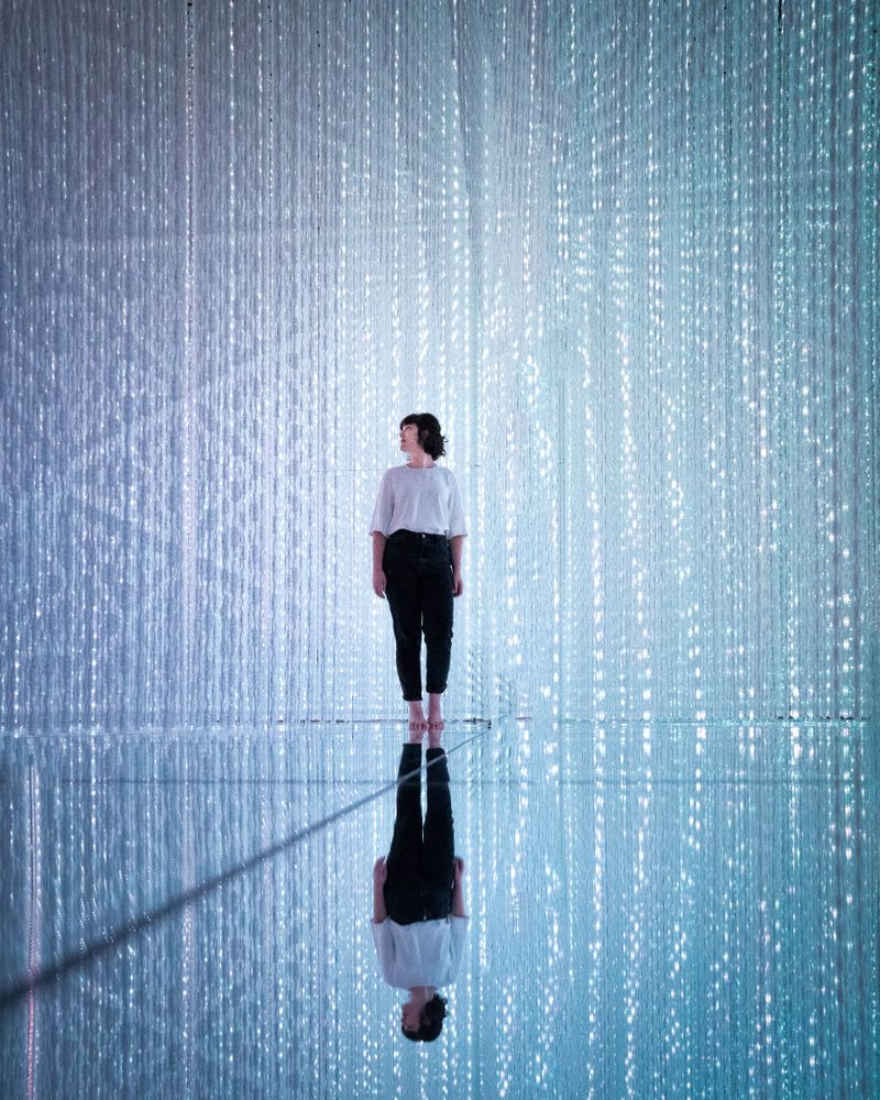 Woman standing against blue background