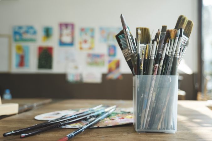 Close up of painting brushes in studio of artist..