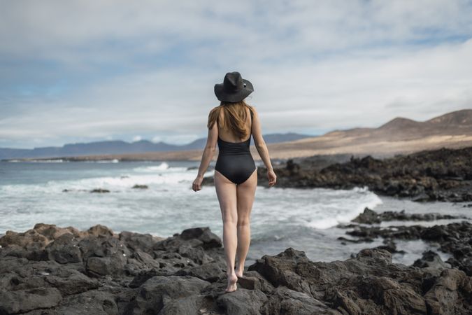 Sensual female near stormy sea