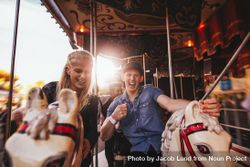 Shot of young couple having fun at an amusement park ride 482lq0