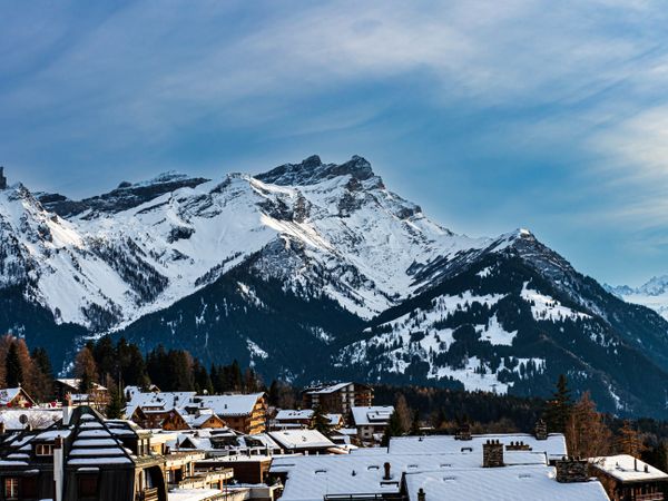 Swiss Alps winter landscape with snow and sun, mountains in Europe
