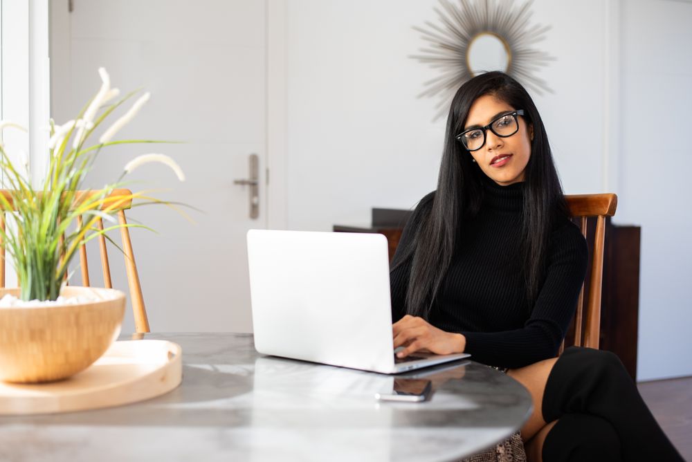 Businesswoman working from home on her computer