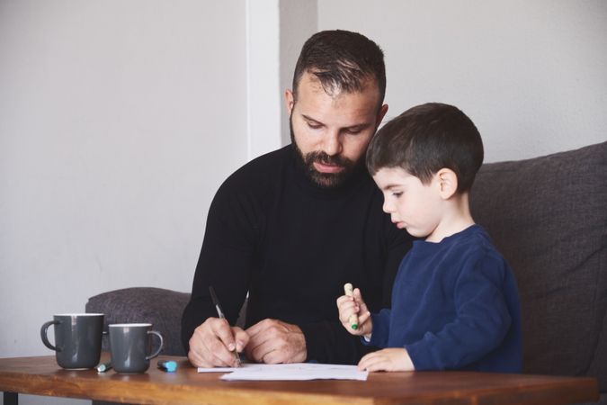 Father and son drawing together