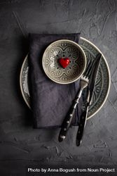 Dark table setting with red heart decoration 4BaavW