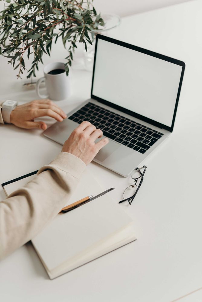 Person using laptop on desk