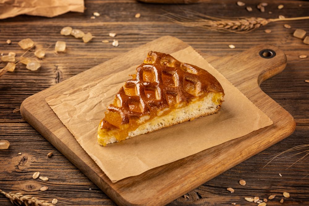 Slice of apricot shortcrust pie