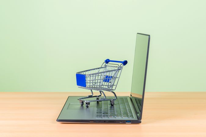 Shopping Cart on Laptop Representing Online Shopping and E-Commerce Concept