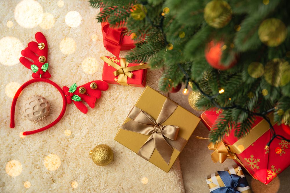 Different Christmas accessories and Christmas tree, top view