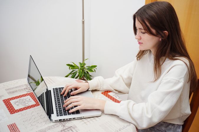 Teenager girl using laptop computer