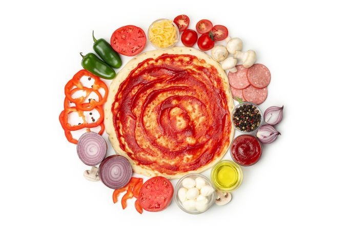 Dough and ingredients for cooking pizza isolated on blank background