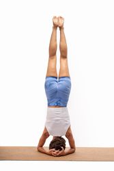 Advanced yoga inversion: Salamba Sirsasana on eco-friendly mat
